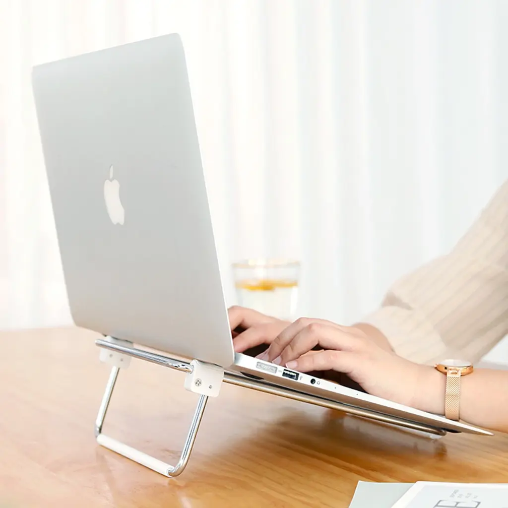 ugreen_adjustable_silver_laptop-stand_typing.webp